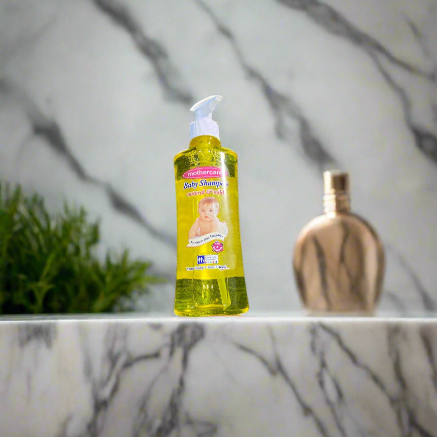 Bottle of baby shampoo on a marble countertop with a blurred background